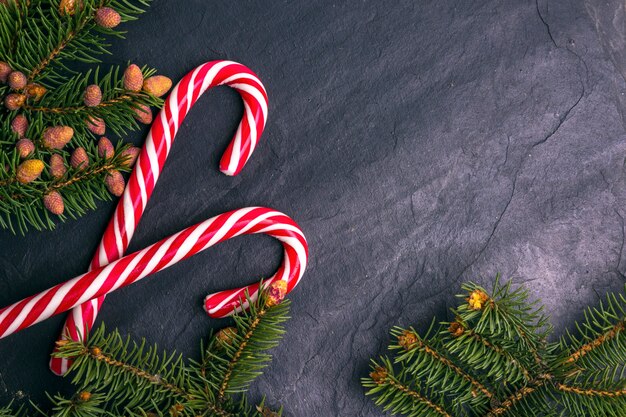 Christmas stone background decorated with fir branches