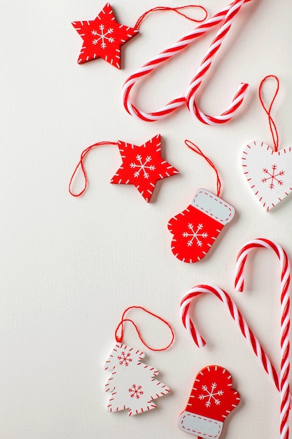 Christmas surface of candy and Christmas decorations in white and red colors