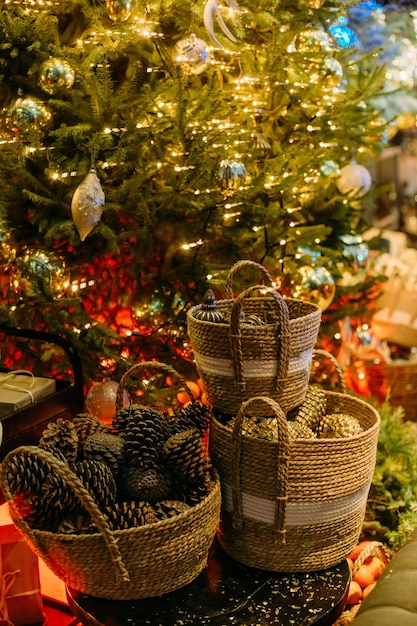 Christmas symbol decorations for the festive tree items balls cones nuts shiny in baskets rustic