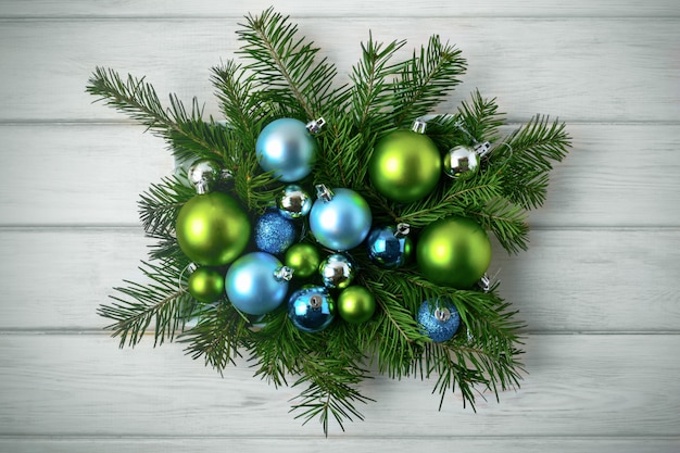 Christmas table centerpiece with blue and green ornaments, toned