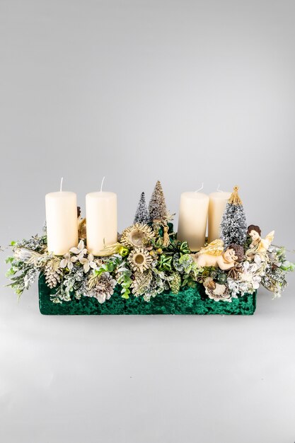 Christmas table composition. Beautiful decoration. Christmas trees, candles, stars, lights and elegant accessories. Merry Christmas and Happy Holidays, Template.