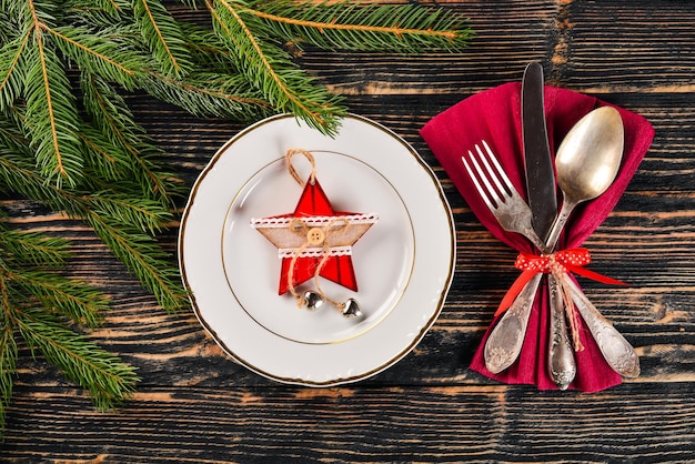 Christmas table decoration Christmas dinner plate cutlery decorated festive decorations Winter holidays Christmas card Free space for your text Merry Christmas Happy New Year