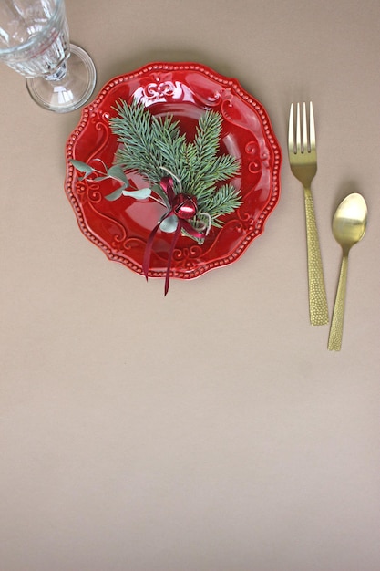 Christmas table decoration. Christmas dinner plate, cutlery decorated festive decorations. Winter holidays. Christmas card. Free space for your text. Merry Christmas, Happy New Year.
