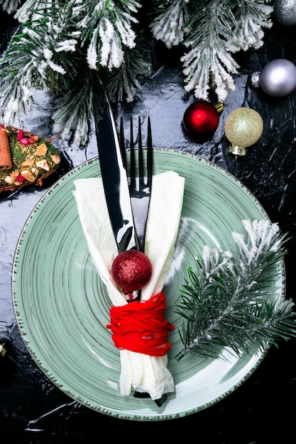 Christmas table place setting. Holidays dinner. 