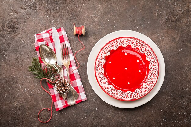 Christmas table place setting with festive decorations