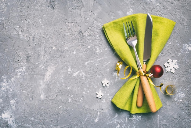 Christmas table place setting with knife napkin and fork Holidays new year background with copy space