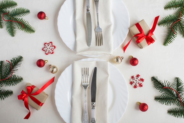 Christmas table setting on the beige tablecloth. Top view. Close-up.