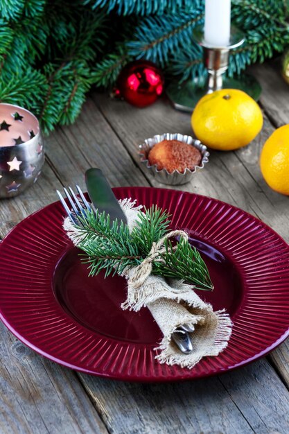 Christmas table setting from cutlery on a plate