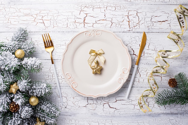 Christmas table setting and golden decor