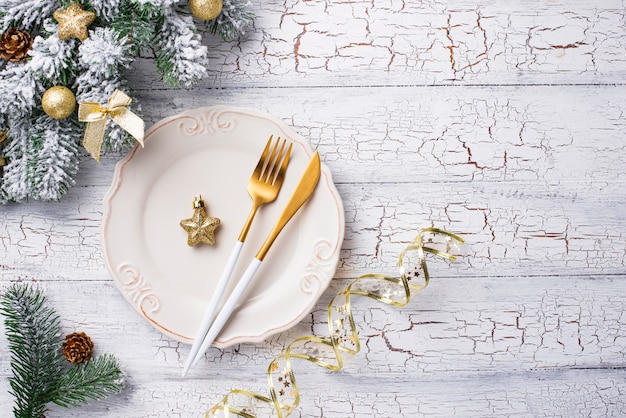 Christmas table setting and golden decor