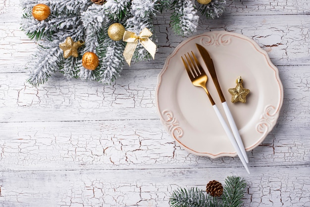 Christmas table setting and golden decor