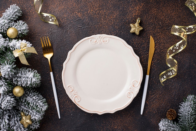 Christmas table setting and golden decor