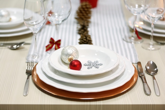 Christmas table setting with holiday decorations