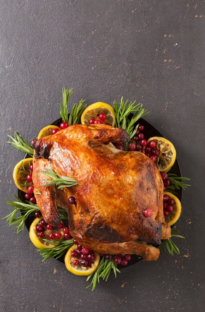 Christmas table with baked turkey or chicken, copy space for text. Christmas dinner,