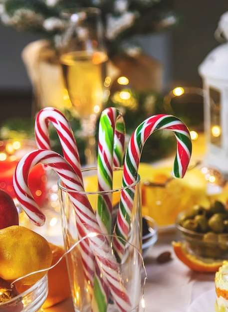 Christmas table with champagne and food. Selective focus. Holiday.