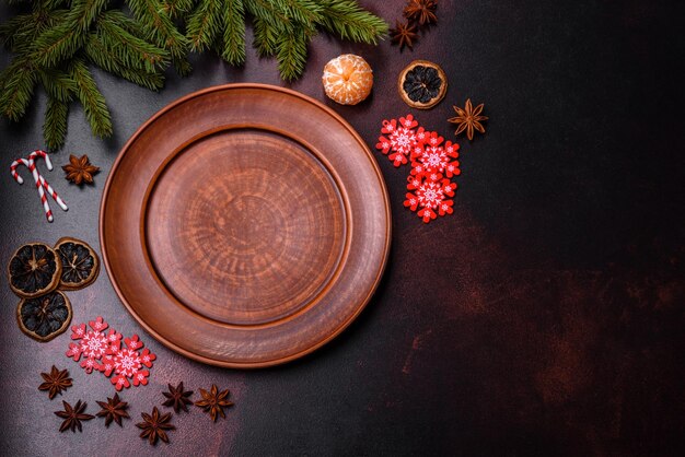 Christmas table with empty plate and surface with New Year's decorations