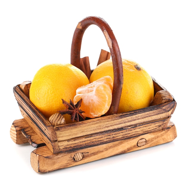 Christmas tangerines in basket isolated white