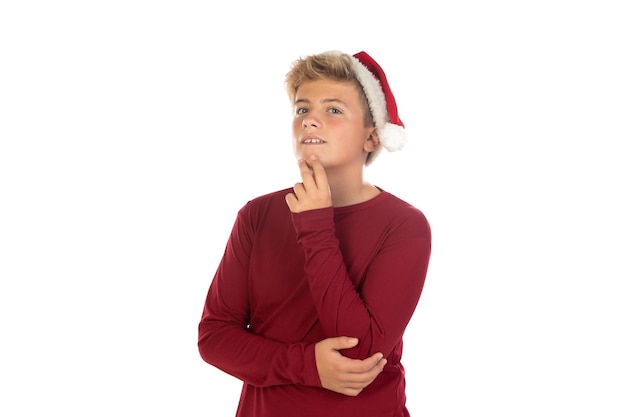 Christmas teen boy in Santa red hat isolated on white background