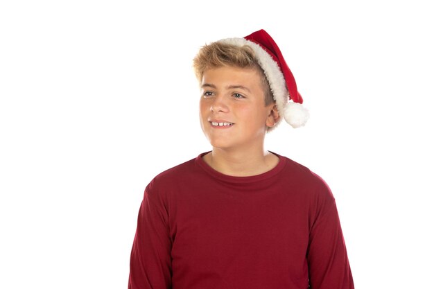 Christmas teen boy in Santa red hat isolated on white background