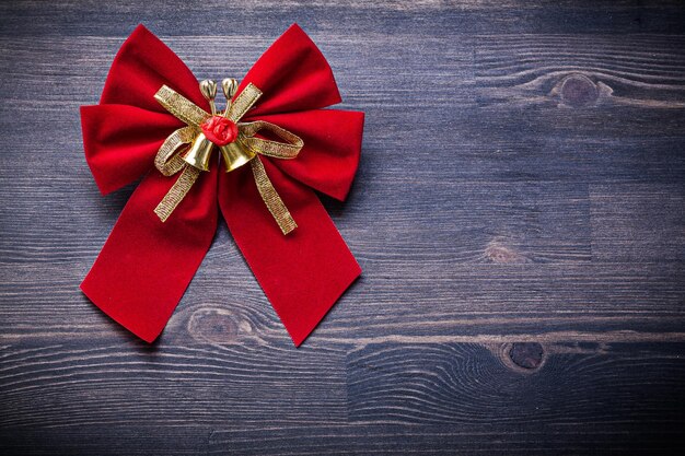 Christmas tied bow on wood board holidays concept