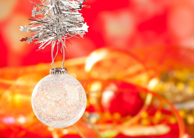 Christmas tinsel snow crystal bauble on red