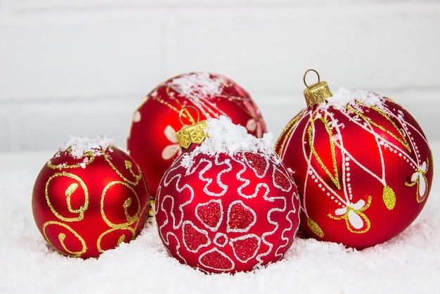 Christmas toys on a light background in artificial snow