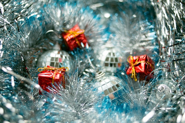 Christmas toys on silver tinsel