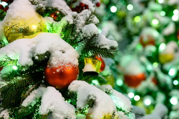 Christmas toys in the snow on the tree