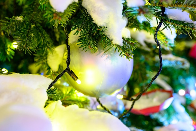 Christmas toys in the snow on the tree