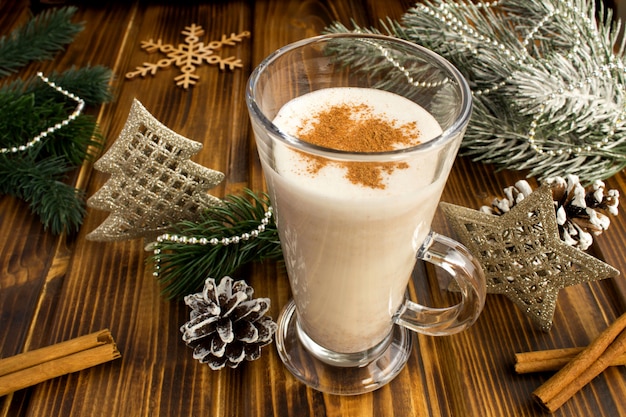 Christmas  tradition eggnog and  christmas composition on the brown  wooden background. Closeup.