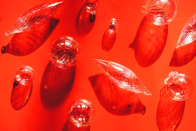 Christmas transparent balls on red background