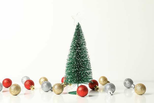 Christmas tree and baubles on white