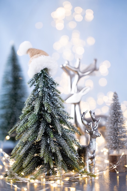 Christmas tree on blue bokeh wall