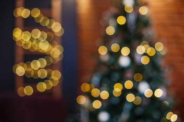 Christmas tree blurred bokeh. Abstract light holiday background