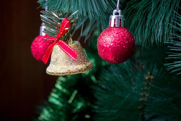 Christmas tree branch with decorations closeup.