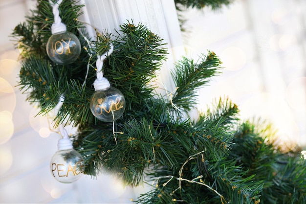 Christmas tree branch with lights and toys