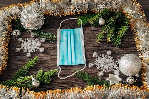 Christmas Tree Branches and Snowflakes on a Brown Background