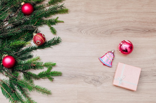 Christmas tree branches and on a wooden background with copy space