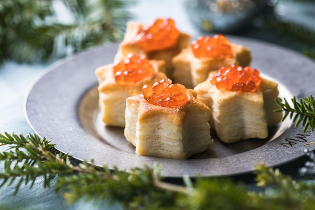 Christmas tree canape or sandwich with cucumber slice salmon for festive xmas snack New year recipe