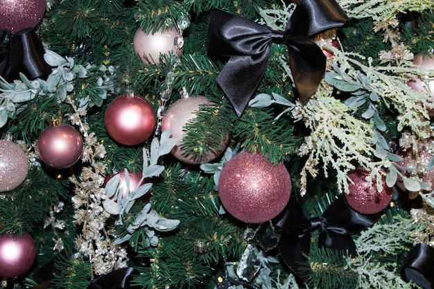 Christmas tree decor closeup in the color scheme greenlilacblack Horizontal orientation