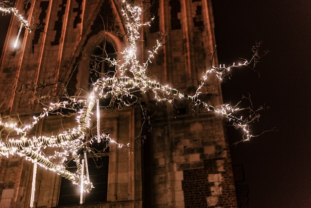 Christmas tree decorated near an architectural building