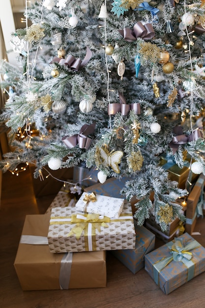 Christmas tree decorated with Christmas decorations and gifts