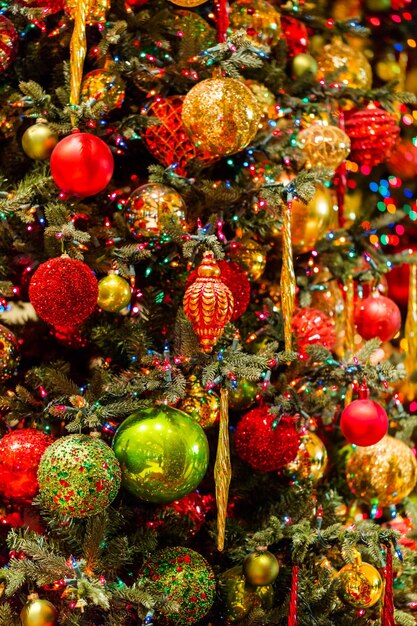 Christmas tree decorated with multicolor ornaments.