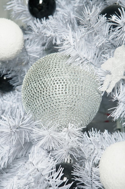 Christmas tree decoration close up white tones