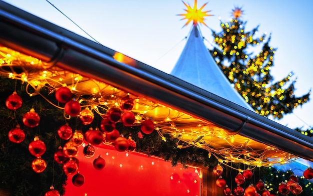 Christmas tree decorations of christmas market at gendarmenmarkt in winter berlin, germany. advent fair and stalls with crafts items on the bazaar. glass