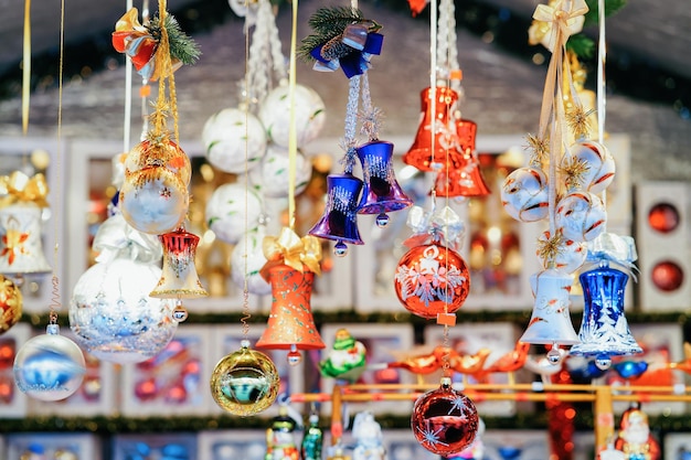 Christmas tree decorations at Christmas Market at Town Hall in Winter Berlin, Germany. Advent Fair and Stalls with Crafts Items on the Bazaar.