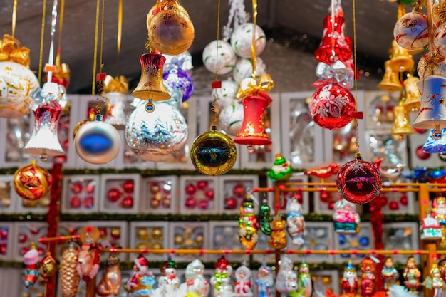 Christmas tree decorations in Christmas Market at Town Hall in Winter Berlin, Germany. Advent Fair and Stalls with Crafts Items, on the Bazaar.