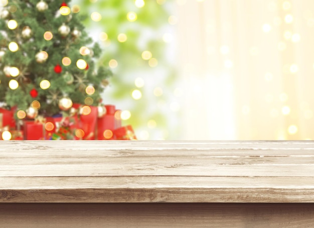 Christmas tree defocused bokeh background with wooden table