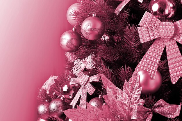 Christmas tree details Image toned in Viva Magenta color of the 2023 year