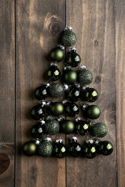 Christmas tree from the christmas balls on the woden background